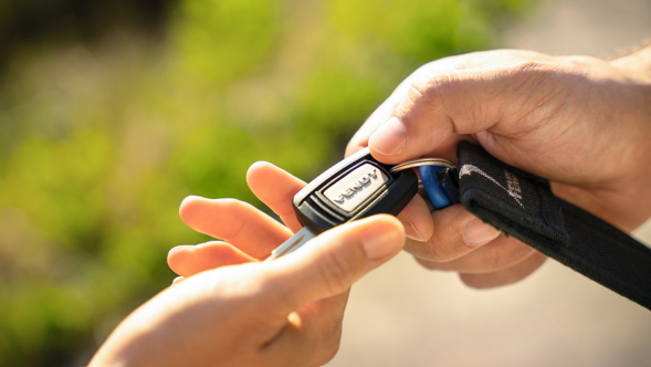 Fendt dealer handing over tractor keys to a farmer