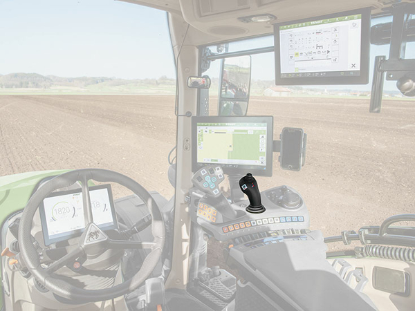 Close-up of the Fendt 700 Vario Gen6 cab in which the crossgate lever is highlighted in colour.