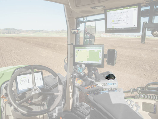 Close-up of the Fendt 700 Vario Gen6 cab in which the pushdial is highlighted in colour.