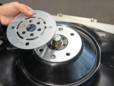 Photograph of the driveGUARD disc in one hand