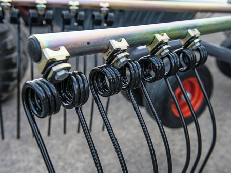 Close-up of the tines of the Fendt Former rotor arms, which are individually bolted under the tine carrier.