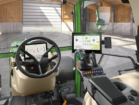 Interior view of a Fendt tractor cab with the FendtONE driver's workstation, which has several screens and the multifunctional armrest.