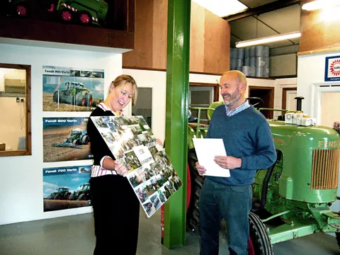 Daughter Becky presents her dad Alan a selfmade collage for the 25th anniversary.