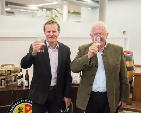 Two men drinking beer