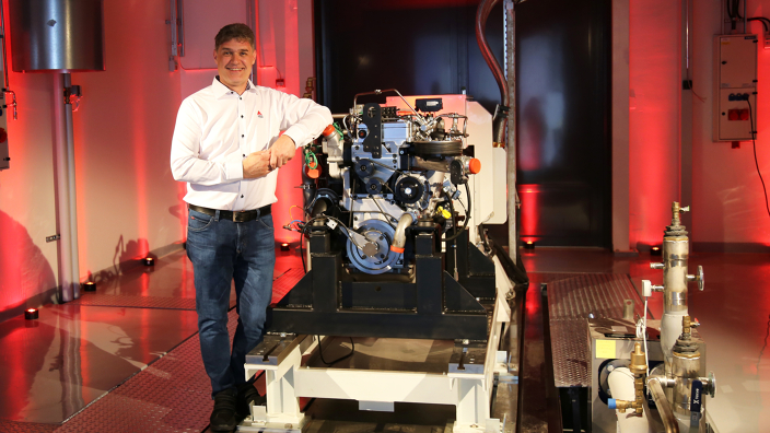 ​ ​Kari Aaltonen, Director of Engineering at AGCO Power, in front of a hydrogen combustion engine in the new Clean Energy Laboratory